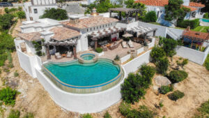 Cabo Luxury Palmilla Estates Discover a standout investment opportunity in coveted Palmilla Estates, where relaxed coastal style meets refined comfort. This single-story 3-bedroom, 3-bath home blends natural stone, warm wood beams, and a gourmet kitchen with high-end appliances, breakfast nook, and full bar. A generous entry courtyard opens to a heated pool, jacuzzi, outdoor kitchen, and a sun-washed yard overlooking the 9th fairway of the Jack Nicklaus Mountain Course. Eligible for a golf membership, it also makes an effortless vacation retreat with close access to Palmilla Beach, world-class amenities, and the charming San José town center. – 115 La Noria, San Jose del Cabo, BS