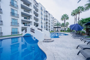 Cabo Luxury Puerta Cabos Village Excellent investment opportunity in Puerta Cabo Village, one of the most sought-after areas in Cabo San Lucas. This 2-bedroom, 2-bathroom apartment is sold fully equipped, ready to move in or continue operating as a vacation rental.It has a pleasant terrace and well-distributed spaces that provide comfort and functionality. Its strategic location, a short walk from El Médano Beach, makes it a highly attractive property for tourists.The property has a proven track record on Airbnb, allowing you to continue generating income from day one without interruption. Ideal for investors or as a second home in Los Cabos, combining profitability, comfort, and proximity to the beach. – 3757 Blvd. Constituyentes, Cabo San Lucas, BS