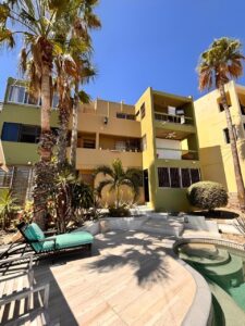 Cabo Luxury Bahia Del Tezal Located in the desirable ocean side area of Cabo San Lucas, within Bahía del Tezal, this bright and well-maintained 2-bedroom, 2-bathroom condo offers one of the best value opportunities in Cabo. The unit features a functional open layout with great natural light, a clean and inviting living space, and move-in ready condition. Ideal for full-time living, a vacation getaway, or a rental investment. Just minutes to Medano Beach and close to shopping, dining, and grocery stores. A great opportunity for savvy buyers seeking rental income potential and strong value. The building offers a rooftop common area with pool, lounge area, and ocean, city, and mountain – 811 Nopal, San Jose del Cabo, BS