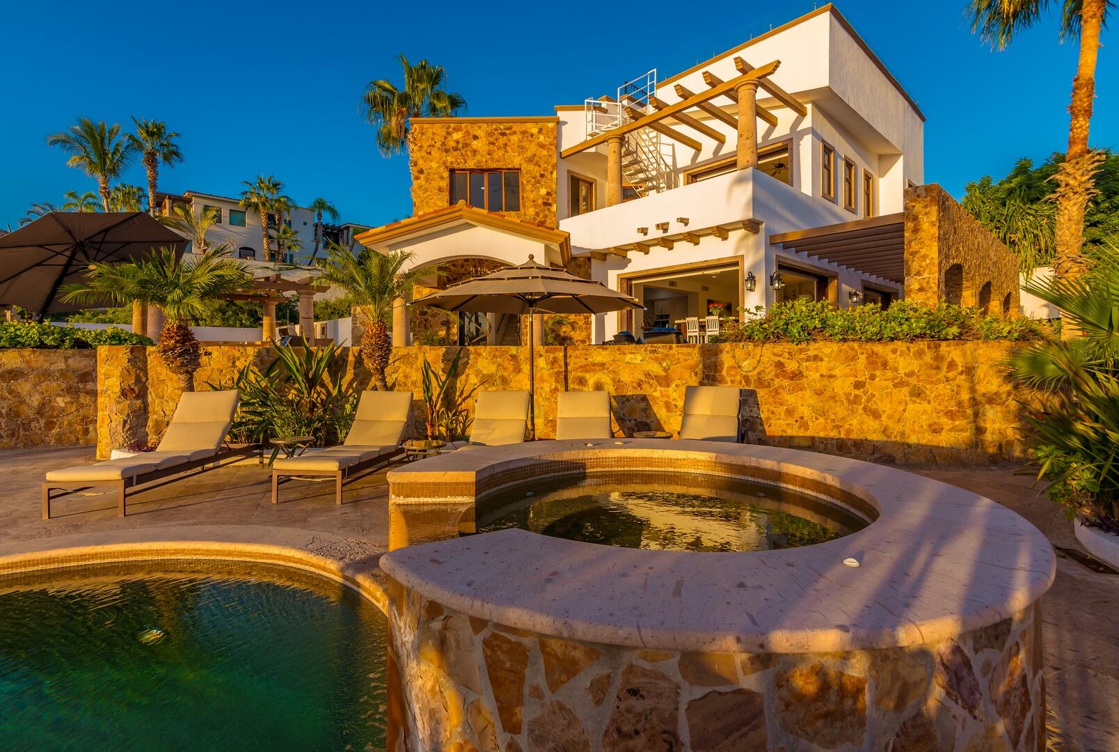 Cabo Luxury Cresta Del Mar Mediterranean-style Home with a poolside bar and generously proportioned patio with its water features, putting green, pool and spa create a playful inviting atmosphere where friends and family will want to gather. Sunset cocktails atop the rooftop deck with its arch for sale