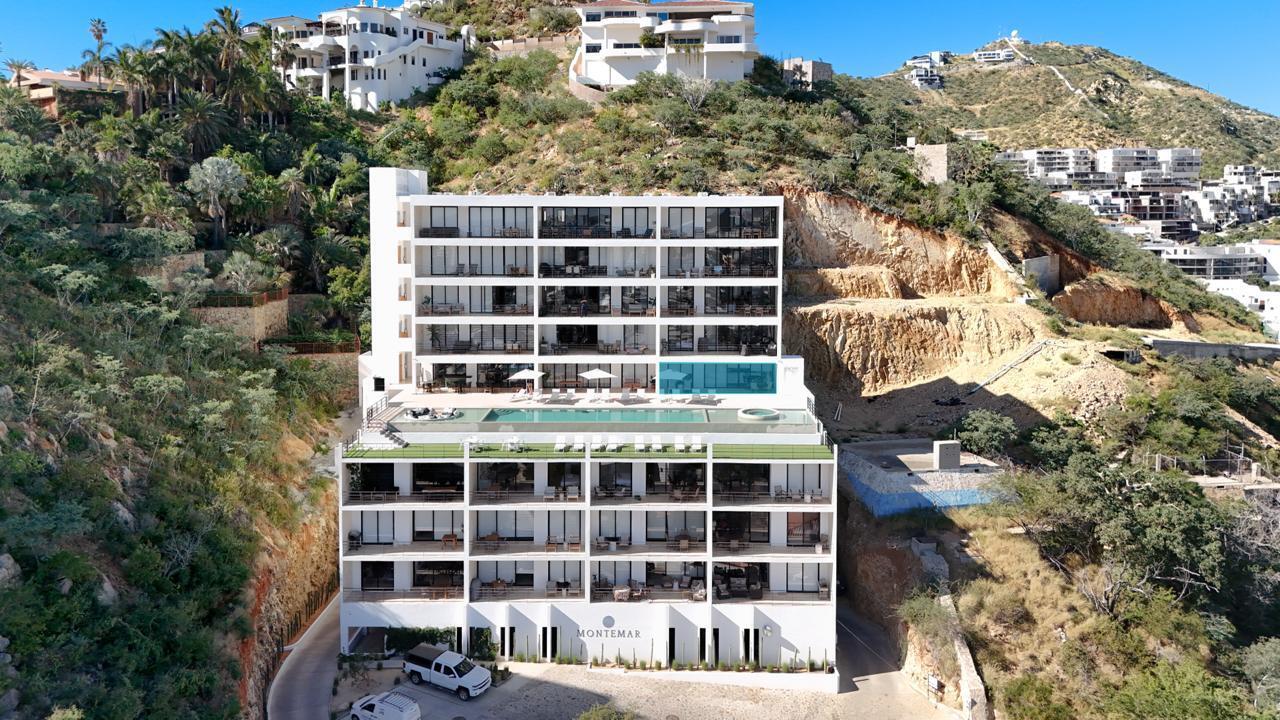 Cabo Luxury Three Point Tower Experience elevated living in this one-of-a-kind turnkey penthouse in downtown Cabo--only 3 penthouse condos in the building. Fully furnished 2BD/2.5BA with designer finishes, two oversized closets, and two secured garage spots behind a mechanic gate and secured entry door. Built in 2023, this stylish retreat offers peace of mind and comfort. Enjoy panoramic bay and city for sale