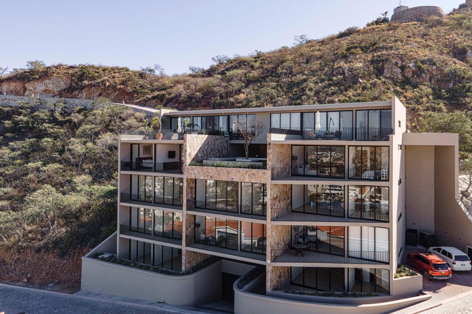 Cabo Luxury Pedregal One Experience the pinnacle of sophisticated Cabo living in this turnkey 2-bedroom, 2-bathroom luxury condominium nestled in the legendary hillside enclave of Pedregal. Boasting modern, contemporary finishes, this premium residence features a sleek minimalist design integrated with a spacious covered terrace--making it the ultimate canvas for indoor-outdoor Baja entertainment.Breathtaking, unobstructed vistas overlooking the sparkling city lights, rugged mountain ranges, and nearby marina. Over 1,600 square feet equipped with high-end stainless steel appliances and a premium extended kitchen island.The Location has unmatched walkability. Skip the car ride and stroll straight down to world-class sportfishing charters, upscale waterfront dining, and vibrant nightlife at the Marina Cabo San Lucas.Exclusive Amenities: 24/7 controlled security, private Pacific beach access, professional tennis/pickleball clubs, a luxury health spa, an organic farmers' market, and a dedicated community water desalination plant. Includes 2 covered underground parking spaces. for sale