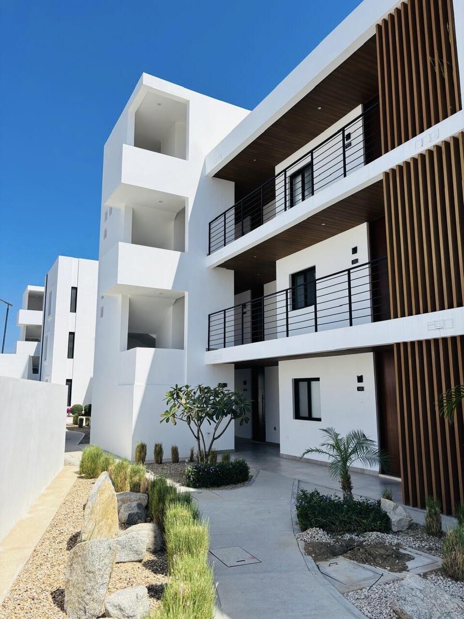 Cabo Luxury Cumbre Del Tezal Discover Yameto in Cabo San Lucas, a condominium that blends modern design, functionality, and comfort in every space. Featuring two bedrooms, two full bathrooms, and parking for two vehicles, it stands out for its high-quality finishes such as marble flooring and a fully equipped kitchen with a quartz countertop. It is delivered fully equipped with included appliances: a 5-burner electric ceramic cooktop, a three-door French Door refrigerator, and a microwave hood, giving you convenience and savings from day one. Additional features like a smart lock and a private terrace. Yameto elevates your lifestyle with amenities designed for maximum enjoyment: a swimming pool, gym, green areas, children's spaces, and a rooftop for gathering or relaxing. With 24/7 security and controlled access. for sale