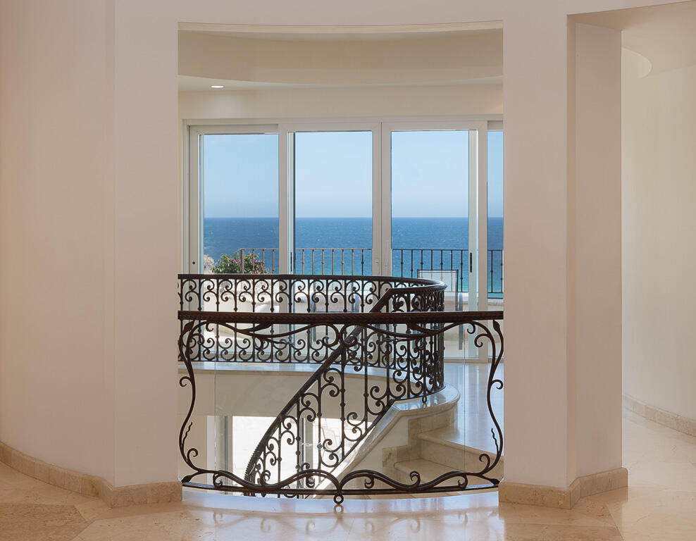 Cabo Luxury Pedregal Csl Villa Marcella sits on an exquisite piece of ocean front property in the exclusive community of Pedregal in Cabo San Lucas. This 6 bedroom 9 bathroom beach estate has a very private location with it's natural mountainside to it's left that make it perfect for entertaining large beach parties, family gatherings, it has even been known to host quite a few a weddings. The beach estate consists of outdoor fire pit, Olympic size swimming pool, jacuzzi, outdoor cooking area, indoor game and bar room accessible from the beach. Enjoy the long beach walks and beautiful Pacific sunrises and sunsets from this beach home. Excellent INVESTMENT property or private home on the beach. for sale