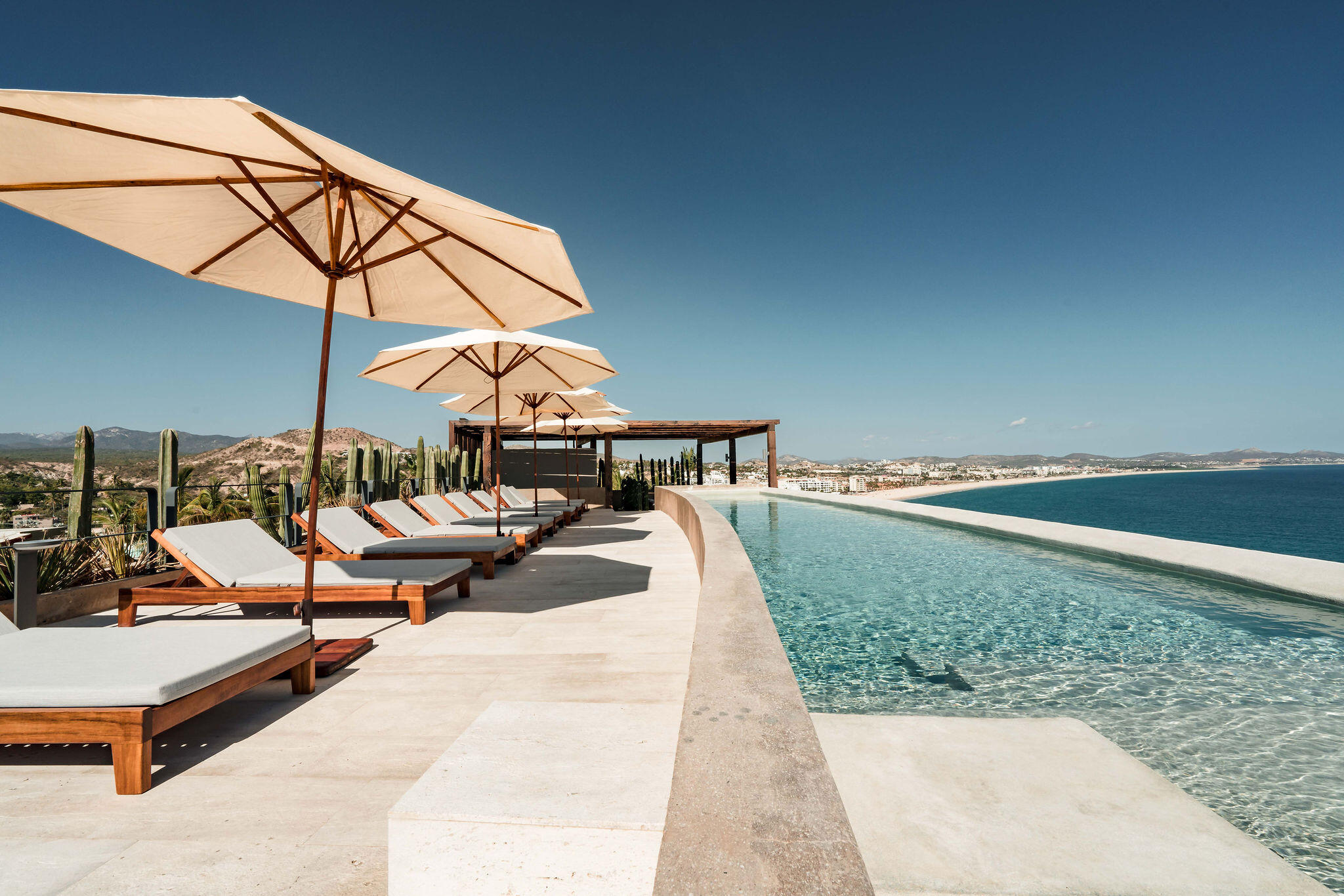Cabo Luxury Dunna Welcome to Dunna - A New Standard of Luxury in Cabo. More than a residence, Dunna is a vibrant, fully integrated community where luxury, culture, and recreation converge. Designed by renowned architect Sordo Madaleno, this visionary development seamlessly blends timeless elegance with natural tranquility, offering meticulously crafted residences and garden villas complemented by world-class amenities. Elevated Living, Unmatched Experiences Choose from 13 thoughtfully designed floor plans from 2 - 5 bedrooms ranging from 1,475 - 6,458 sq. ft., featuring seamless indoor-outdoor living, elegant finishes, private rooftops, Jacuzzis, and lush garden terraces. Resort-Style AmenitiesEnjoy unparalleled amenities, including:" Infinity pools (Adults-only, Family, Kids & Oasis)" State-of-the-art wellness & fitness center" Luxury spa (sauna, steam, ice baths, massage suites)" Exclusive rooftop lounges & panoramic for sale