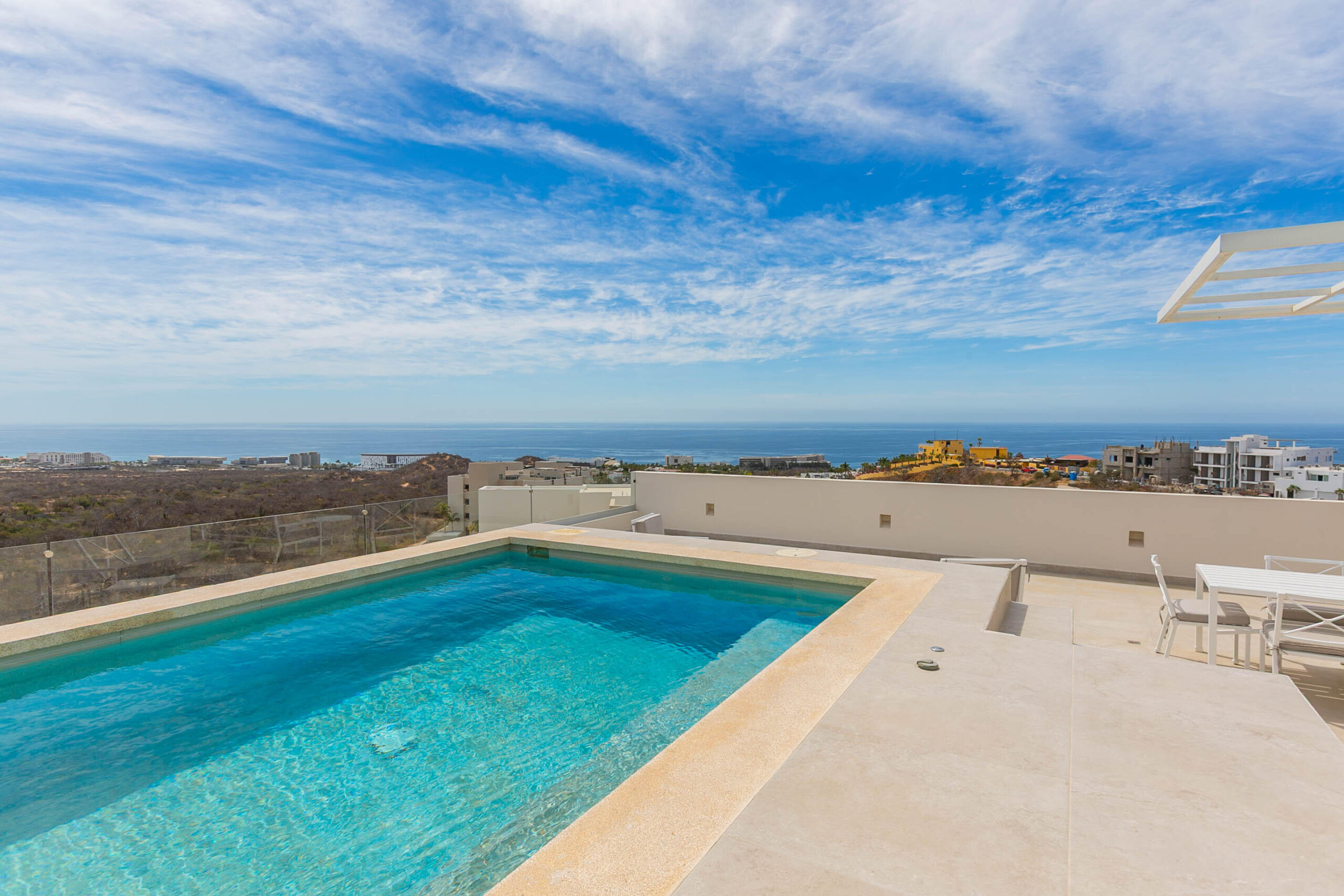 Cabo Luxury El Tule-Inland:General Located in one of El Tule's most relaxing communities, Vistamar Penthouse 2502 is a turnkey design masterpiece. This stunning residence features approximately 1,506 square feet of interior living space complemented by an exceptional 1,184 square feet of rooftop area, creating an expansive and airy atmosphere with breathtaking ocean and desert for sale