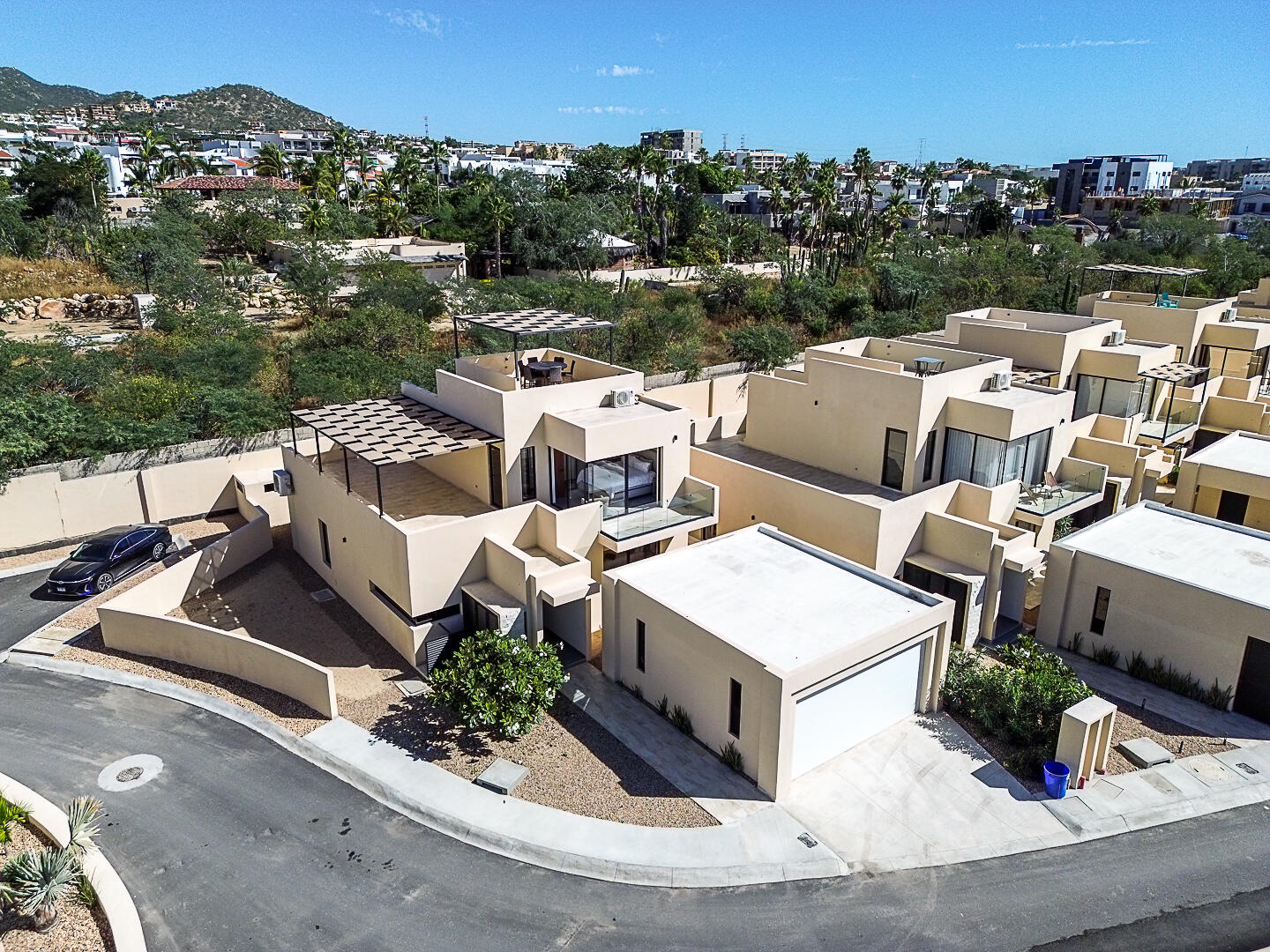Cabo Luxury Terranova Beautiful turnkey two-story corner home located in the gated community of Terranova Residencial. The main level offers an inviting living and dining area, a kitchen with granite countertops and pantry. Also a flex room ideal as a guest bedroom or home office.The second level features three bedrooms, including a spacious primary suite with walk-in closet, bathtub, and double vanity, plus two additional bedrooms connected by a Jack-and-Jill bathroom.Enjoy a private backyard with an 80 m² garden, swimming pool, and BBQ area, perfect for entertaining. The rooftop terrace with pergola and BBQ area offers beautiful sunset for sale