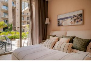 Cabo Luxury Las Arenas Enjoy the ultimate luxury of direct, walk-out access to the sparkling pool and premium amenities right from your terrace. the condominium A106 Beautifully designed with 2 serene bedrooms and 2 full, modern bathrooms.Thanks to its thoughtful design, the apartment is bathed in natural light, creating a remarkably warm, fresh, and welcoming atmosphere from the moment you step inside.It is located in Las Arenas, just 5 minutes away from the beach – 106 CALLE ACCESO AL RIU, Cabo Corridor, BS